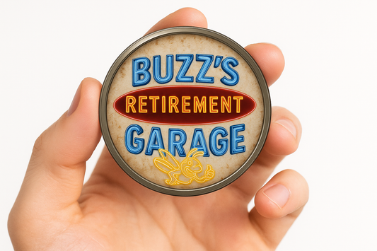 Hand holding a coin with 'Buzz's Retirement Garage' text and logo.